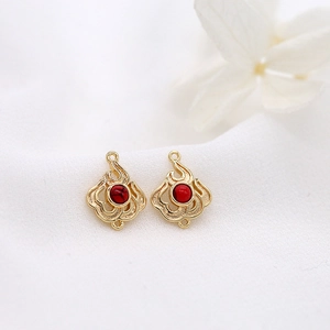 Gold flame pattern jewelry connectors with red stone inlays for DIY earrings