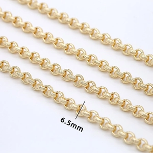Detailed macro view of 6.5mm wide textured round links chain in 14K gold plating