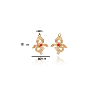 Detailed view of 14K gold plated flower connector with red bead for DIY jewelry making