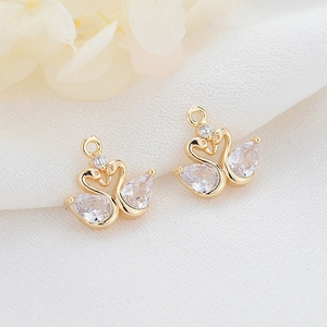 Elegant 14K gold plated swan charms featuring sparkling cubic zirconia for jewelry DIY