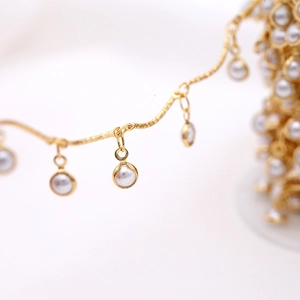 Golden DIY jewelry chain with delicate round faux pearl charms for handmade accessories