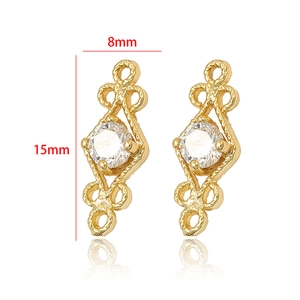 Detail showing 8x15mm hollow flower charm with 14k gold plating and white zircon stone