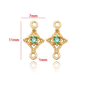 Detail of 14k gold plated rhombus jewelry connector with green zircon and 11x7mm dimensions