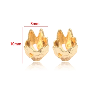 Detail of 14k gold plated rhombic jewelry connector with rock texture, 10mm x 8mm