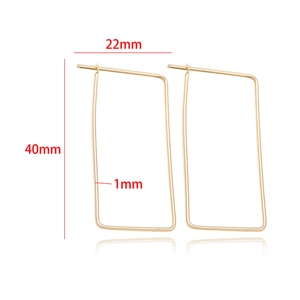 Detail showing 40mm long and 22mm wide rectangular gold hoop earrings with dimensions