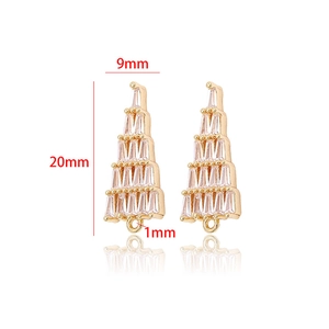 Detailed view of gold Christmas tree earring charms with dimensions 20mm by 9mm
