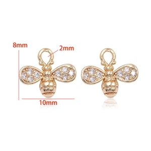 Detail of bee charms in 14k gold plated copper with rhinestones for DIY jewelry making