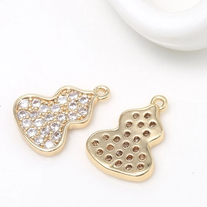 Detail view of 14k gold-plated brass gourd pendant with micro-pave white cubic zirconia