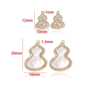Close-up of 14k gold plated gourd charms in two sizes with zircon and mother of pearl