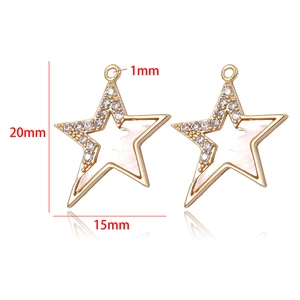 Detail of star-shaped gold pendant with shell inlay and crystals, size 20mm by 15mm