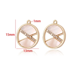 Detailed view of 15mm gold-plated shell pendants with cubic zirconia inlay and dimensions