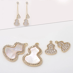 14k gold plated wulu pendant with shimmering mother of pearl and cubic zirconia stones