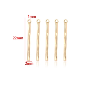 Detail of 14k gold plated bar pendant measuring 22mm by 2mm for DIY jewelry making
