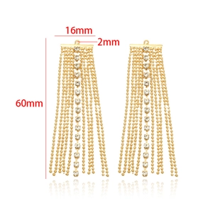 Detail view of 14k gold plated tassel earrings with dimensions 60mm by 16mm