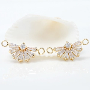 Close-up of fan-shaped 14k gold plated connectors with zircon inlay for DIY jewelry making