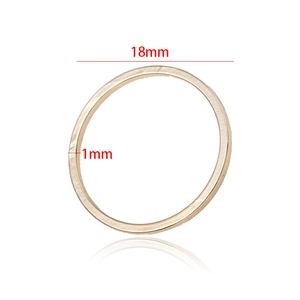 Detail view of 18mm golden DIY brass ring accessory with a 1mm thickness measurement