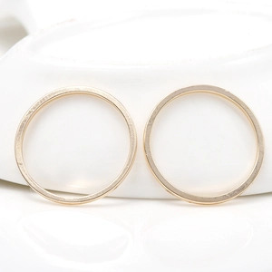 Set of two gold-plated closed copper rings for DIY jewelry making with a polished finish