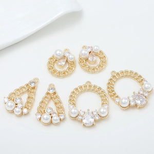 Detail of 14k gold plated flower bead caps with pearls and zircons for jewelry DIY