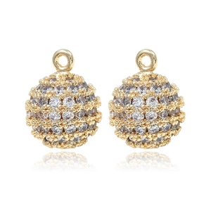 Copper plated 14k gold spherical pendant with micro-pave cubic zirconia on white background