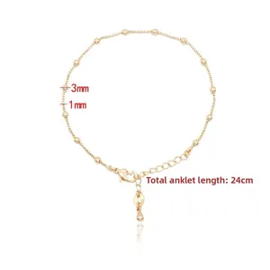 Macro detail of 14k gold plated anklet with 3mm beads and adjustable lobster clasp