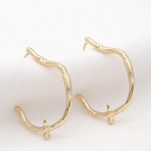 Detail of 14K gold wavy line earring components with polished finish for DIY jewelry