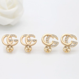 Elegant gold double G earrings with pavé zircons and a hollow petal base decoration