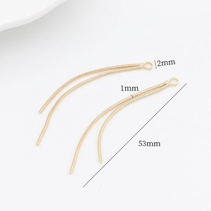 Detail view of 14k gold-plated tassel earrings component with 53mm length measurement
