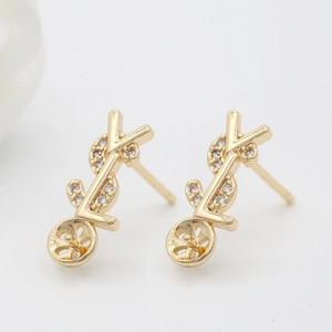 Elegant gold earrings with sparkling zircon stones and a circular base for pearl setting