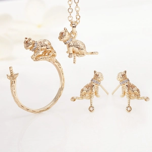 Golden cat jewelry set with necklace, earrings and open ring featuring white zircons