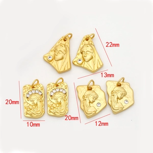 Golden religious pendant charms set with zircon inlay and saint portrait carvings