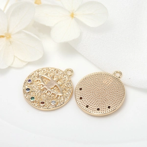 Macro shot of gold-plated evil eye coin pendant featuring colorful zircon stones and texture