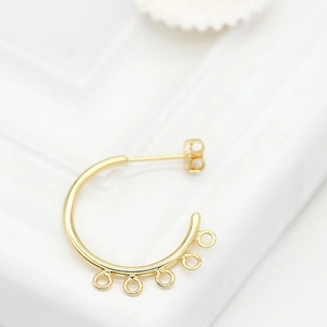 Detailed macro view of 14K gold plated C-shape earring hooks with 5 hanging loops for DIY