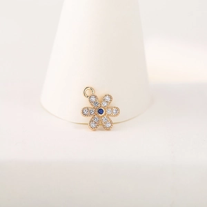 Exquisite 14K gold plated flower pendant with blue zircon center and pavé petals
