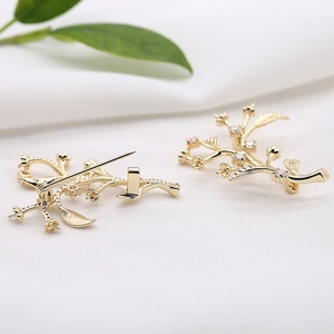Golden micro-pave zircon branch brooches with elegant floral design and safety pin clasp