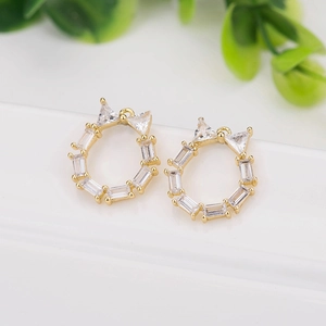 Detail of gold-plated champagne branch pendants with micro-set zircon and bowknot design