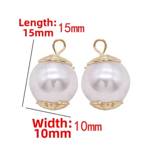 Detailed view of 15mm x 10mm pearl pendant charms with 14k gold spiral texture caps