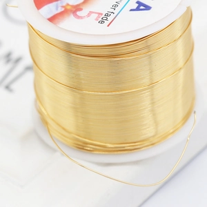 Golden non-fade jewelry copper wire for DIY crafting on white spool for handmade accessories