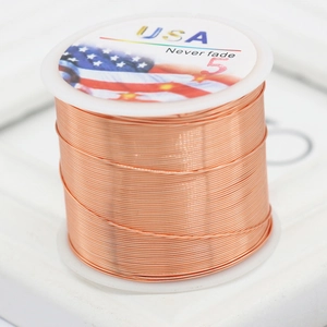 Macro shot of non-fading rose gold copper wire spool for DIY handmade jewelry crafting