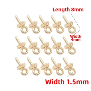 Detail view of 14K gold plated diamond lace earring pendants with shell texture on white