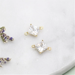 Macro view of square cubic zirconia 14K gold plated connectors for DIY jewelry making