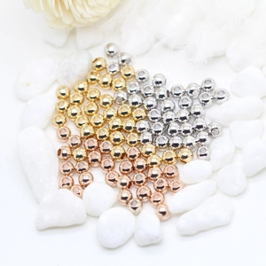 Macro shot of 14K gold plated beads for DIY jewelry making in gold silver and rose gold