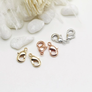 Detailed view of DIY 14k gold-plated jewelry spring clasps in gold, silver and rose gold