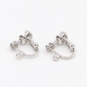 Close-up of silver screw-back earring converters with adjustable U-shape design