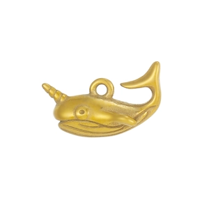 Detail of golden narwhal pendant showing spiral tusk and textured stainless steel finish