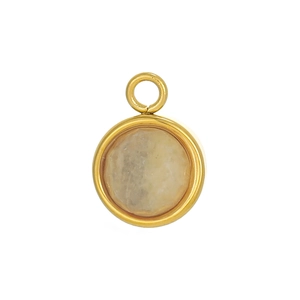 Close-up of a circular gold-plated pendant with an inlaid translucent yellow gemstone