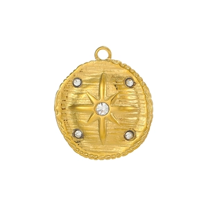 Close-up of vintage gold circular tarot pendant with starburst cubic zirconia inlay