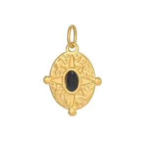 Macro detail of hammered gold oval pendant with black gemstone and starburst pattern