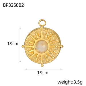 Macro view of gold sunburst tarot pendant with measurements and product dimensions
