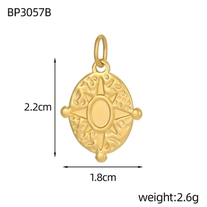 Detailed size view of the 2.2cm gold oval pendant with star pattern and hammered texture