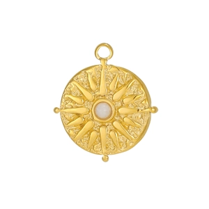 Detail of vintage round tarot sun pendant in gold plated steel with zircon and hammer texture